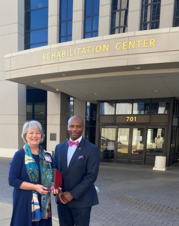 UT Health Rehabilitation Center Administrator Laurie Lehnhof-Watts (from left) is presented with a 25-year tenure award by Corey Cotton, Texas Hospital Association member ambassador for the North Texas Region.